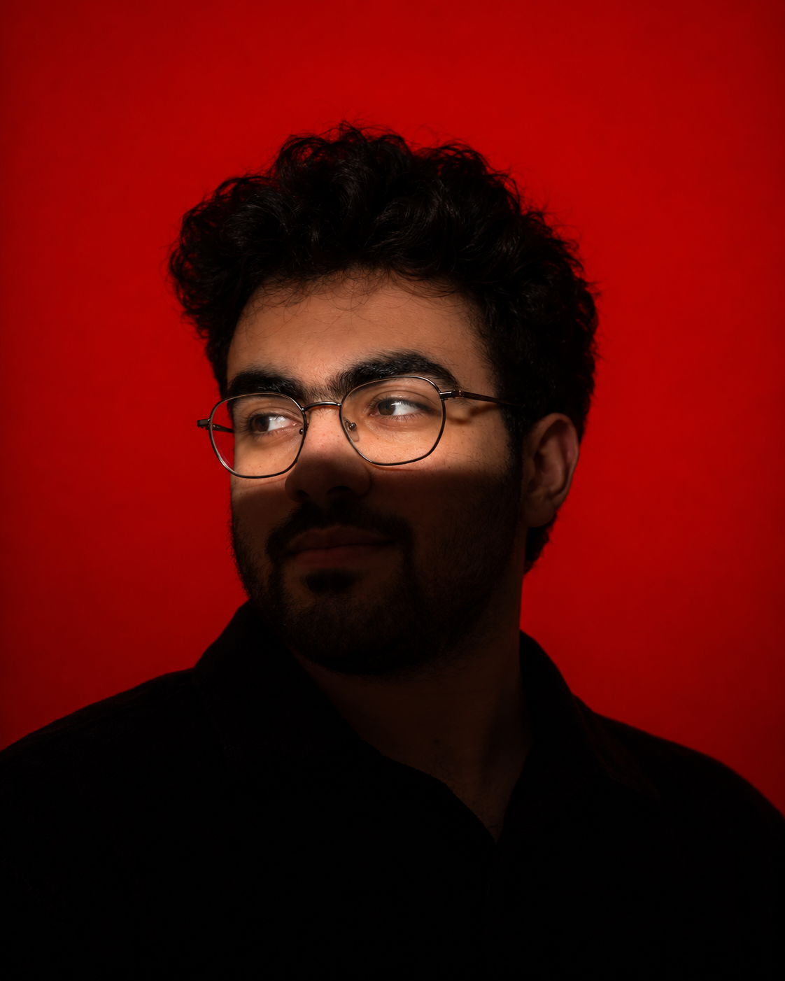 Abdelrhman Abdelnaby, in a cinematic portrait with red lighting
